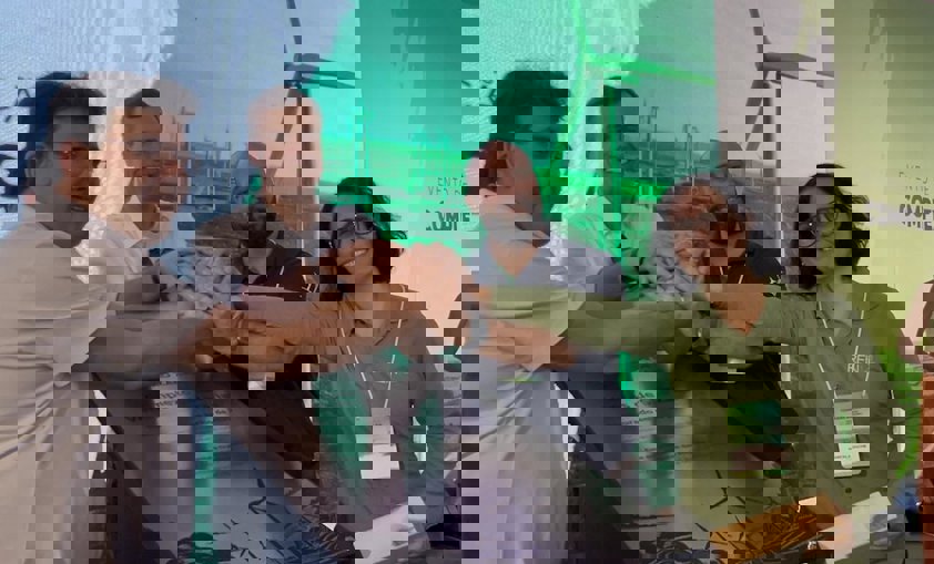 a group of people sitting at a table